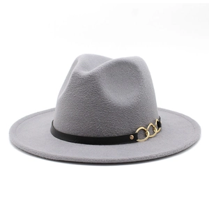 Detail of wool fedora hat with black leather band and interlocking gold metal buckles