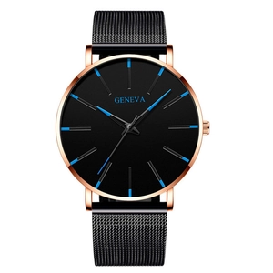 Macro shot of rose gold watch case with blue indices and black mesh stainless steel strap