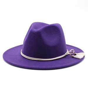 Dark purple wool fedora hat with white rope band and tassel details on white background