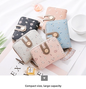 Detailed view of floral printed short wallets in five pastel colors with L-zipper closure