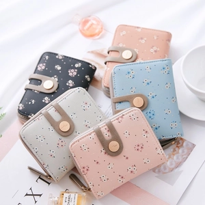 Short floral zip wallet for women in multiple pastel colors with decorative round buckle