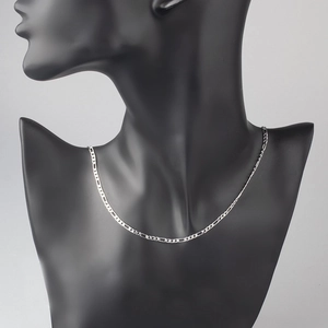 Detail of 2.5mm silver copper Figaro chain displayed on a black mannequin bust