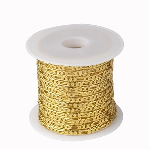 Close-up of 2.5mm golden flat Cuban chain on a roll for DIY jewelry making and necklaces
