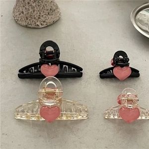 Pink heart mini hair claws and textured plastic hair clips in black and clear colors