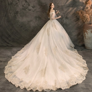 Detailed corset back with lacing and luxury lace embroidery on a long bridal train