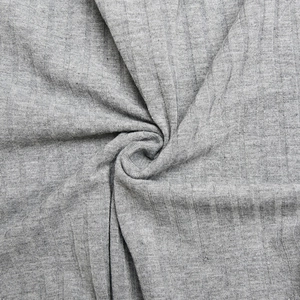 Macro shot of grey ribbed knit fabric showing soft texture and elastic material detail