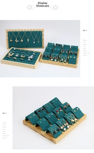 Detailed view of teal velvet jewelry display stands with wooden frames for necklaces and rings