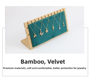 Bamboo jewelry organizer with green velvet backrest showcasing multiple necklaces