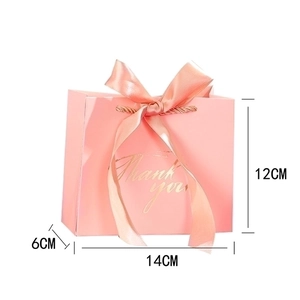 Pink gift bag with gold Thank You text, ribbon bow, and medium size dimensions