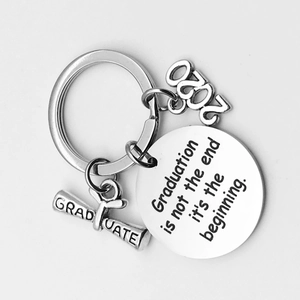 Detail of silver stainless steel graduation keychain with 2020 charm and engraved plaque