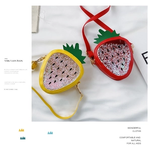 Detail of red and yellow strawberry sequin crossbody bags for kids with glitter window