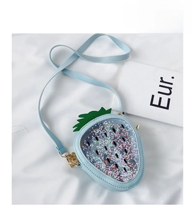 Close-up of strawberry sequin bag with star confetti and gold hardware details