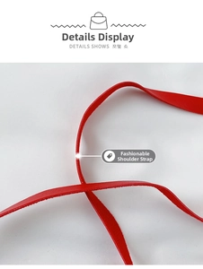 Close-up of red leather shoulder strap with smooth edges and durable texture detail