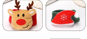 Close-up of plush reindeer and Santa hat snap bracelets showing soft fabric details