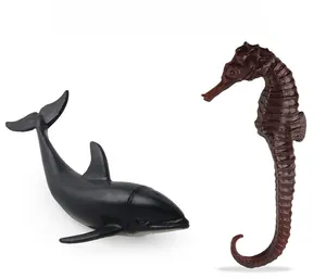 Macro detail of realistic whale and seahorse figurines with lifelike textures