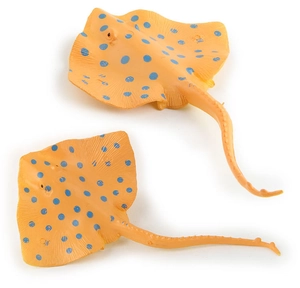Detailed top view of two yellow stingray figurines with blue spots on white background