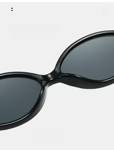 Detailed close-up of the integrated nose pads on these chic oval black sunglasses