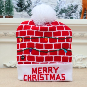 Detail of knitted Christmas hat featuring integrated LED lights and Merry Christmas text