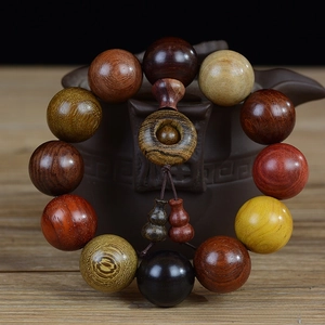 Detail of 20mm multi-wood bead bracelet with lucky coin bead and gourd charms