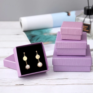 Lilac jewelry gift box set with linen texture showing vintage pearl earrings