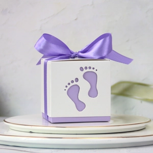 European baby shower candy box with hollow footprints design and purple satin ribbon