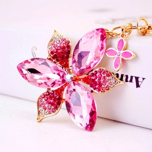Pink rhinestone flower keychain with crystals and gold-plated alloy on white gift box