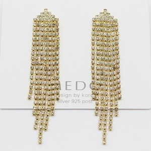 Detail of long tassel drop earrings with sparkling rhinestones and S925 silver posts