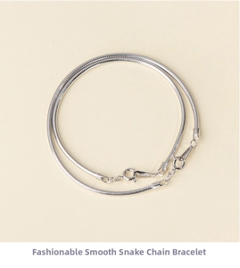 Detailed view of sleek S925 sterling silver snake chain bracelet with lobster clasp closure