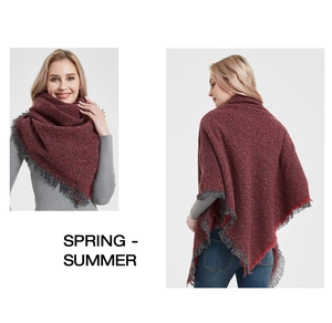 Front and back view of a thick red knitted shawl with gray fringe trim on a model