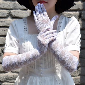 Detailed view of white floral lace gloves with long full-finger design for sun protection
