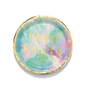 Flat lay of a pastel marble paper plate with gold foil Happy Birthday script