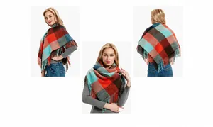 Detail view showing red and orange plaid scarf texture and fringe tassels on white background