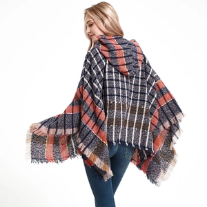 Women's multi-colored plaid hooded poncho with fringe details and warm boucle yarn