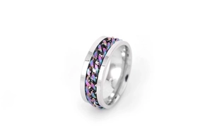 Close-up of rotatable stainless steel ring with colorful rainbow chain inlay