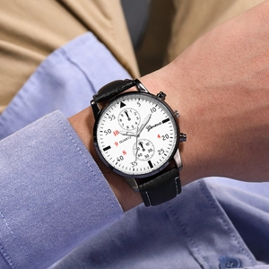 Close-up of Geneva men's slim watch with black leather strap and white stitch detail