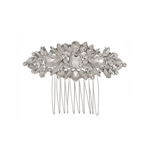 Macro shot of silver bridal hair comb with shimmering crystals on a white background