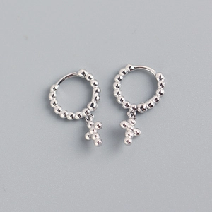 Detailed view of S925 sterling silver hoop earrings with beaded cross drop charms