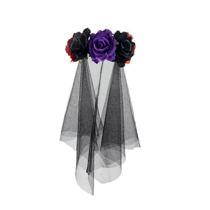 Close-up of gothic purple and red artificial roses with black mesh veil on headband