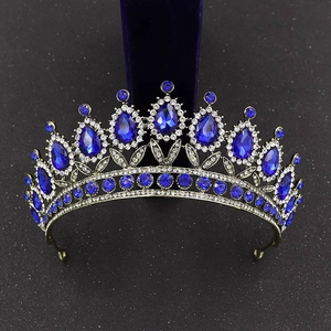 Close-up of Baroque crown featuring blue water-drop crystals and vintage bronze finish
