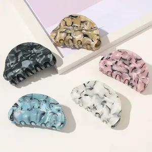 Set of marble texture acetate hair claws in five colors with spring closure mechanism