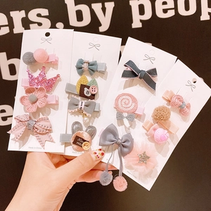 Schattige haarspeldjes voor meisjes met stoffen strikjes en bloemmotieven in vier sets