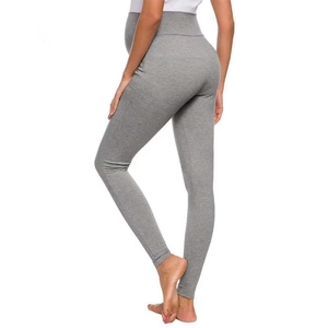 Side view of grey maternity leggings showing comfortable high waist belly support design