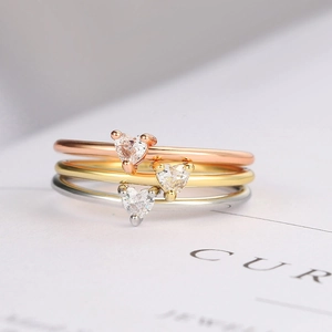 Three-piece heart-cut zircon stacking ring set in rose gold, yellow gold, and silver