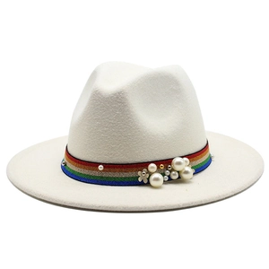Detail of white wool fedora with pearl embellishments and rainbow ribbon band