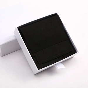 Minimalist white drawer jewelry box with black microfiber pouch for necklaces and earrings