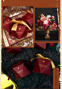 Detail of red pyramid wedding favor box with gold ribbon and Thanks Best Wishes text