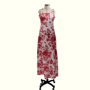 Detail of red floral maxi dress with tiered skirt and adjustable spaghetti straps