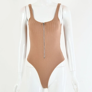 Close-up of beige ribbed knit bodysuit featuring a front zipper and high-cut leg detail