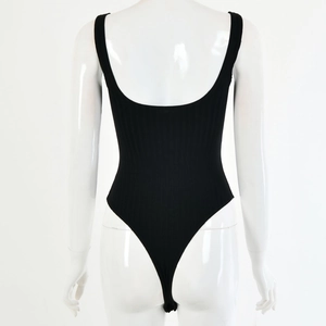 Detail of black ribbed bodysuit featuring a deep U-shaped backless cut on a mannequin