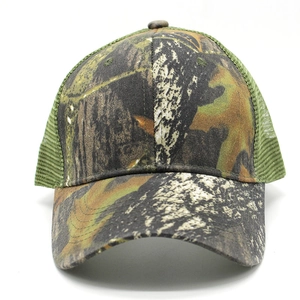 Close-up of camouflage baseball cap featuring green breathable mesh and curved brim